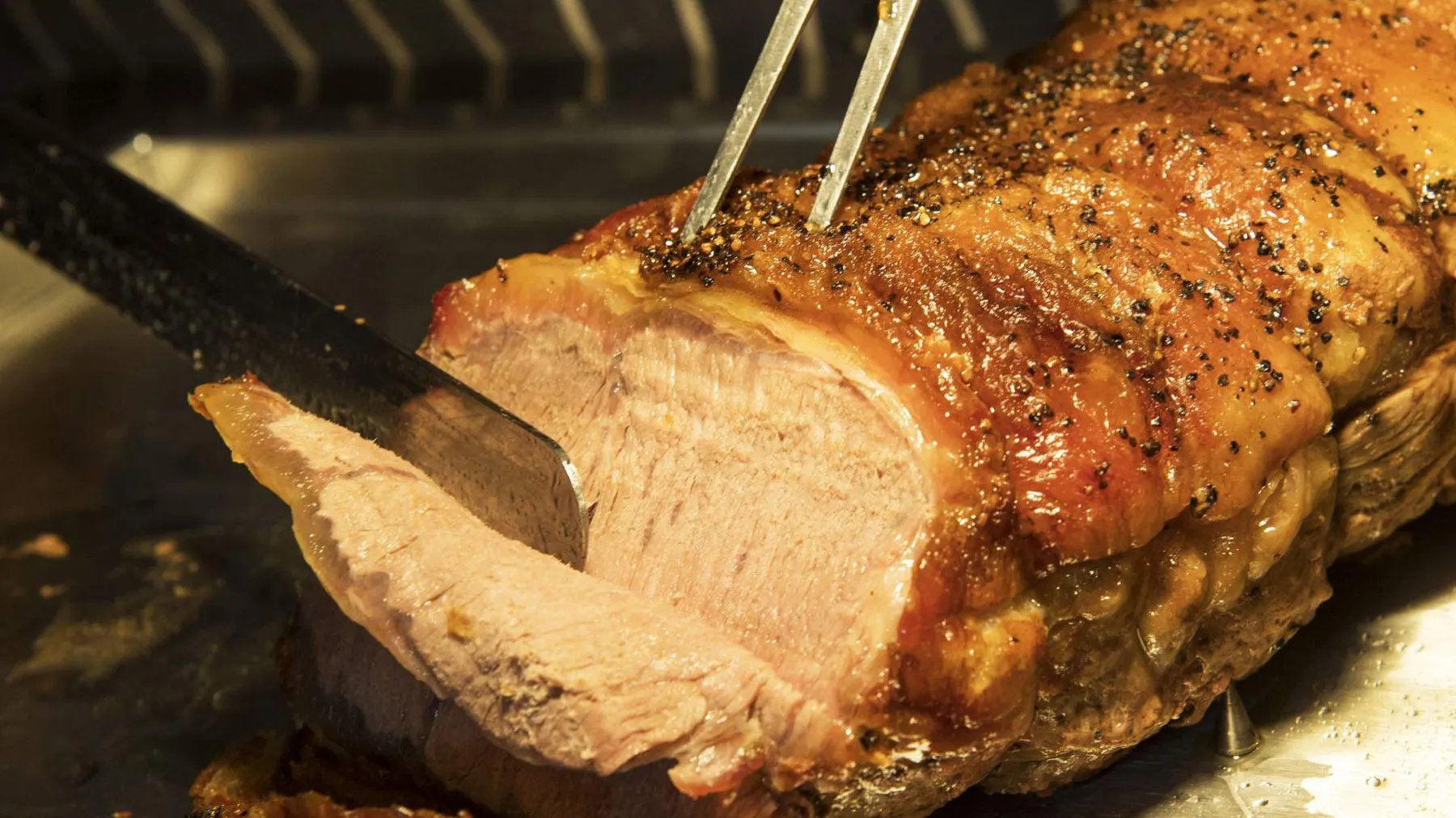 A joint of roast pork being carved at The Stags Head