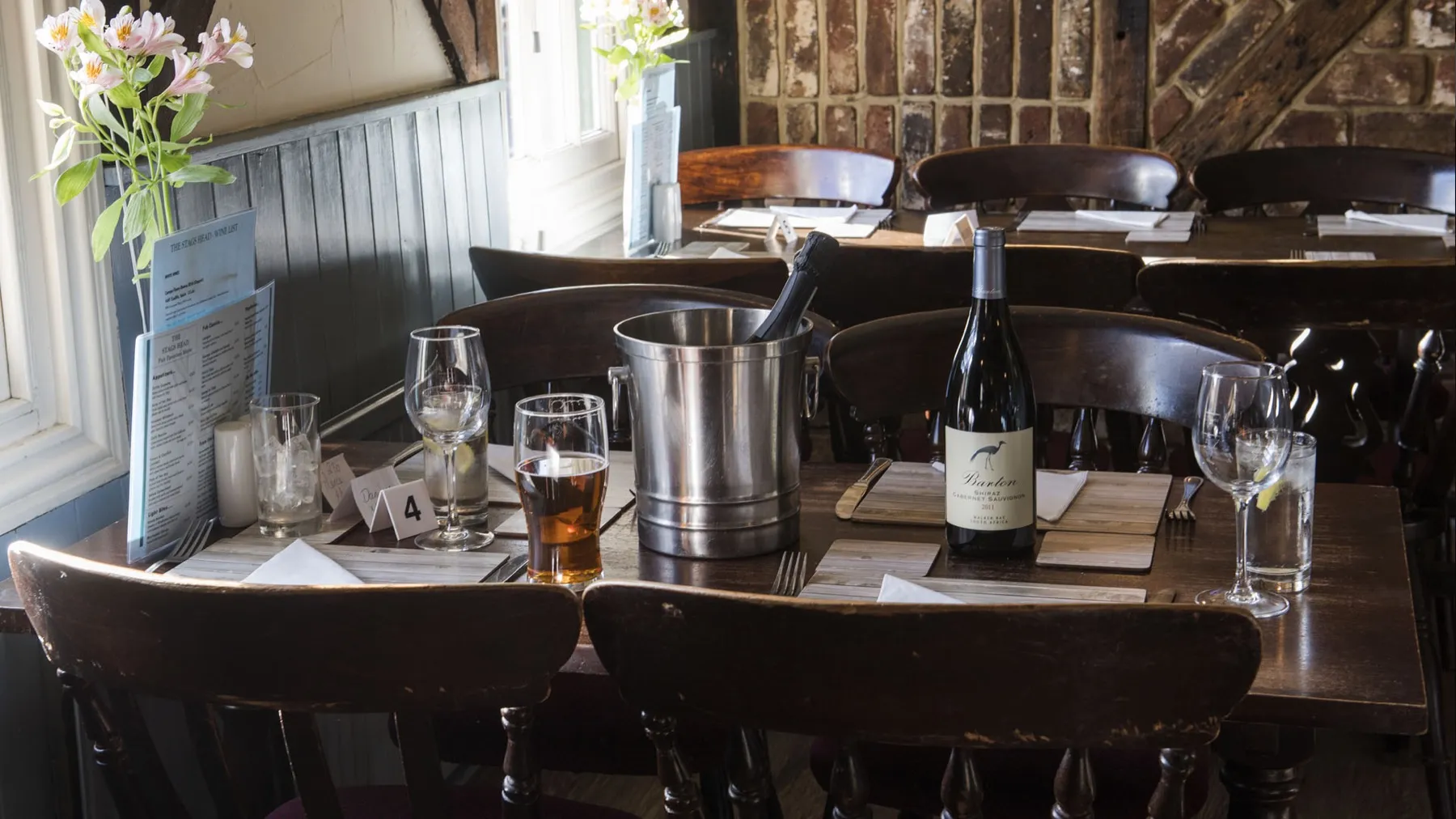 Tables laid for dinner in the restaurant at The Stags Head