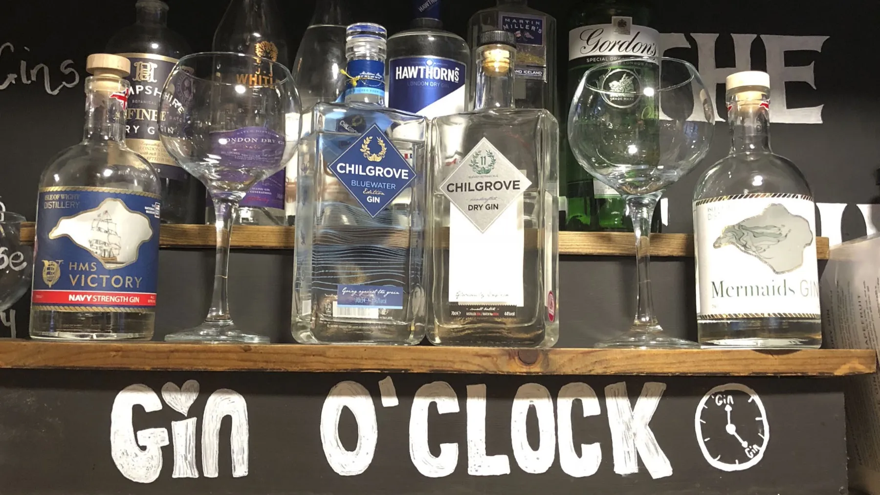 The gin shelf at The Stags Head with local gins from Sussex and the Isle of Wight